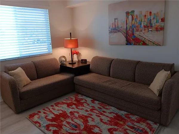 a living room with furniture and a couch