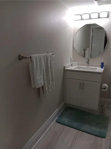 a bathroom with a sink and mirror