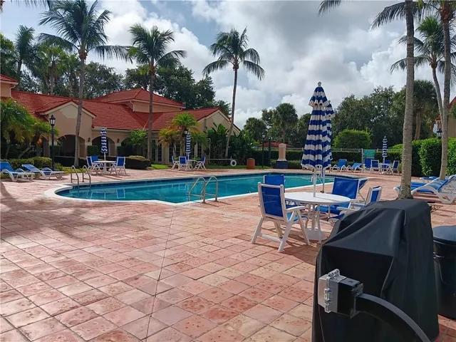 a view of a backyard with a patio
