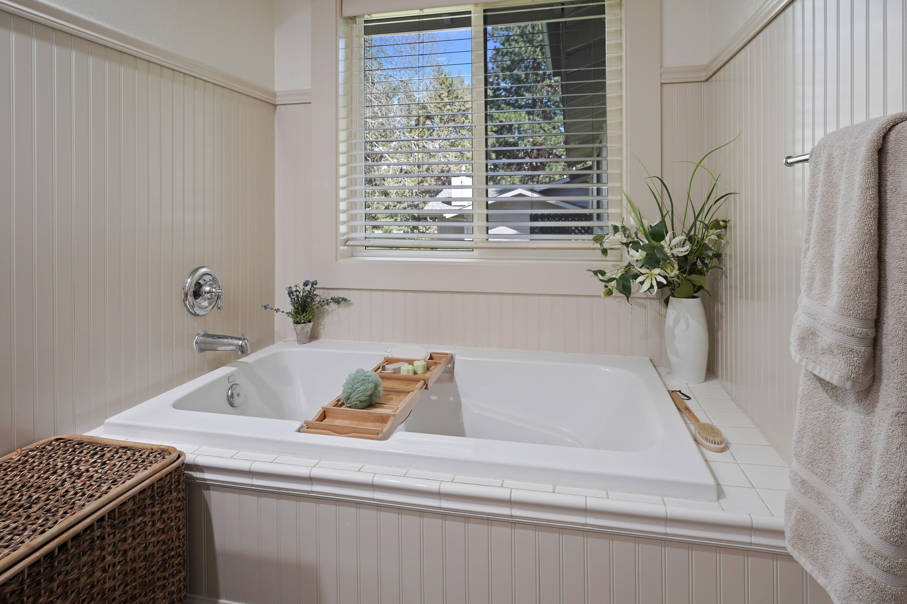 20452 Mainline Road Bend, OR 97702 - Photo 22 of 40 a bath tub sitting in a bathroom next to a window