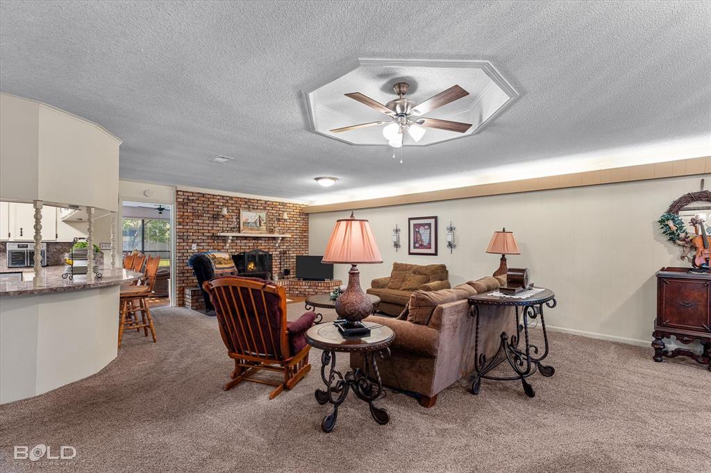 202 Butler Street Springhill, LA 71075 - Photo 14 of 38 a view of a livingroom with furniture and a kitchen