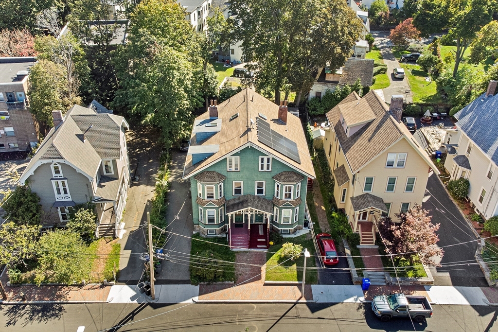 16 Mayfair Street Boston, MA 02119 - Photo 2 of 36 a front view of house with a garden