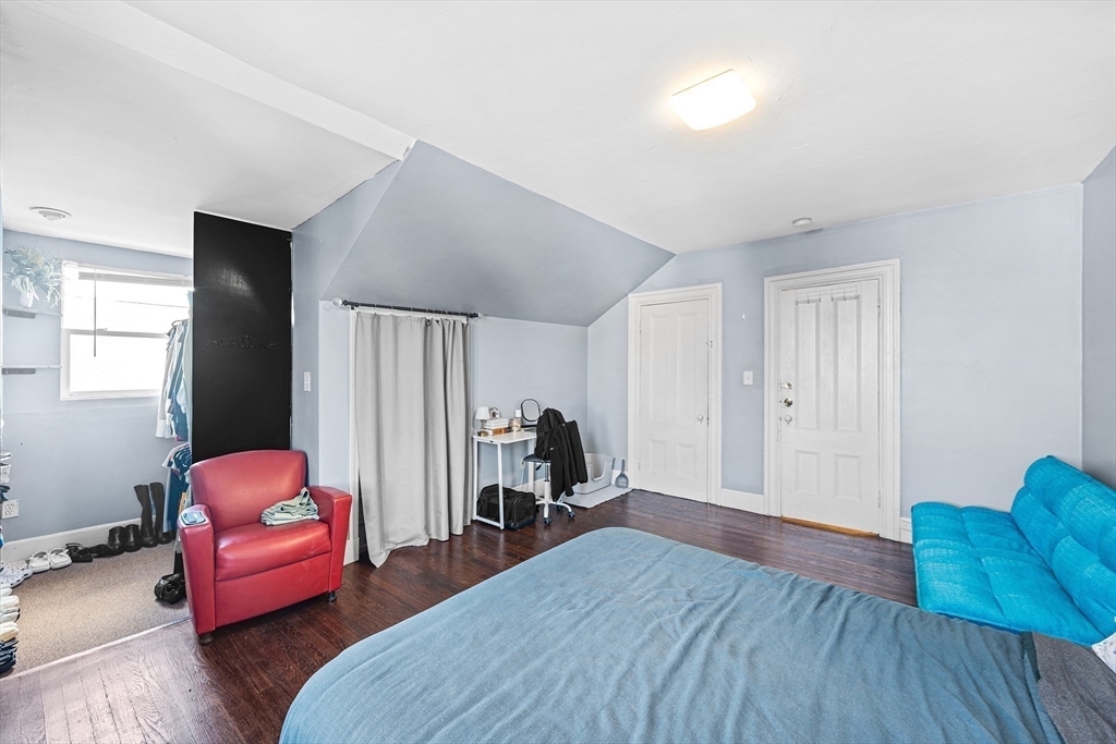 16 Mayfair Street Boston, MA 02119 - Photo 22 of 36 a bedroom with bed and a couch