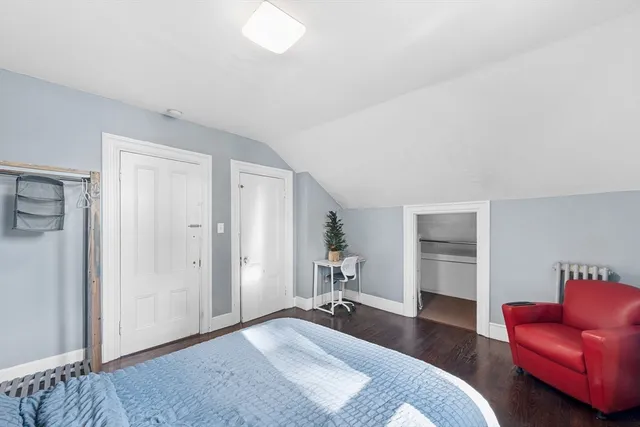 a bedroom with a bed and furniture