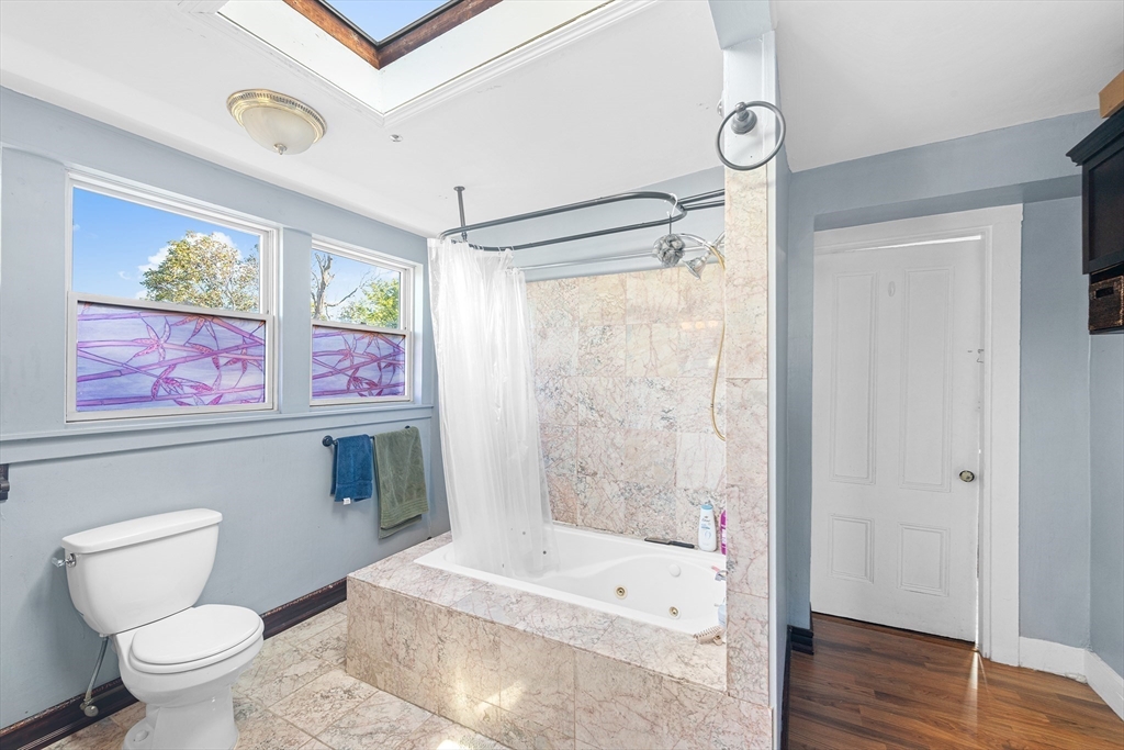 16 Mayfair Street Boston, MA 02119 - Photo 27 of 36 a bathroom with a toilet a sink and a shower