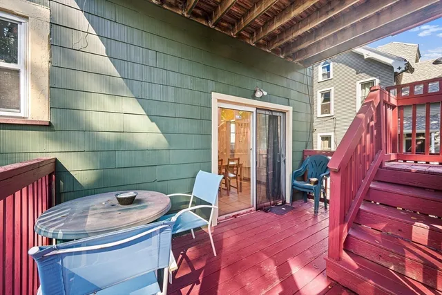 a view of a balcony with furniture