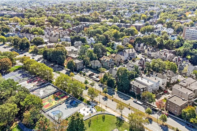 an aerial view of residential houses with outdoor space