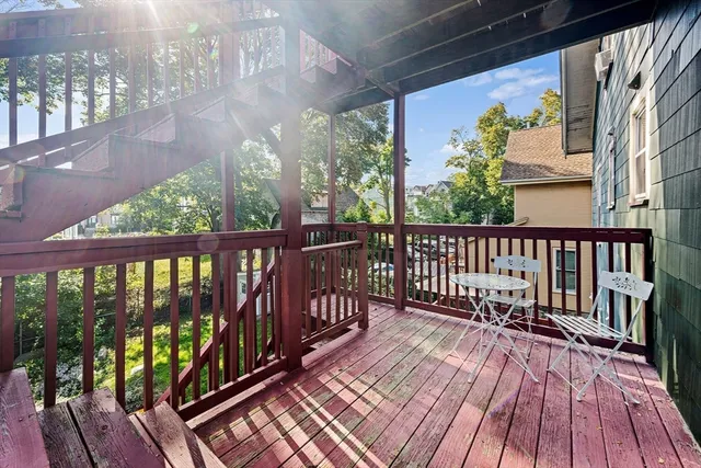a view of balcony with wooden floor