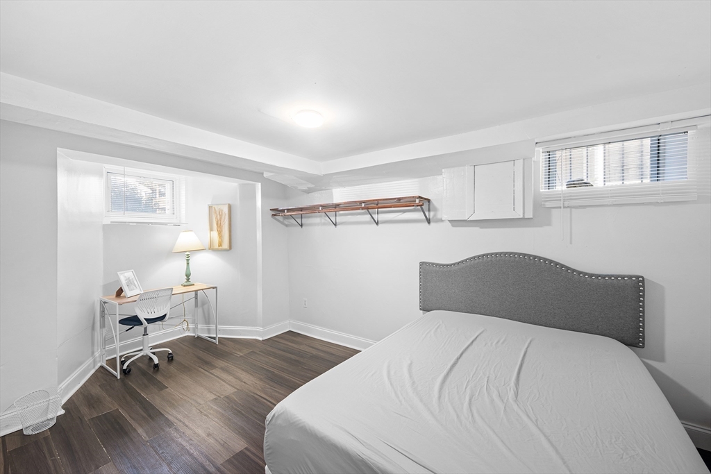 16 Mayfair Street Boston, MA 02119 - Photo 10 of 36 a bedroom with a bed and a window