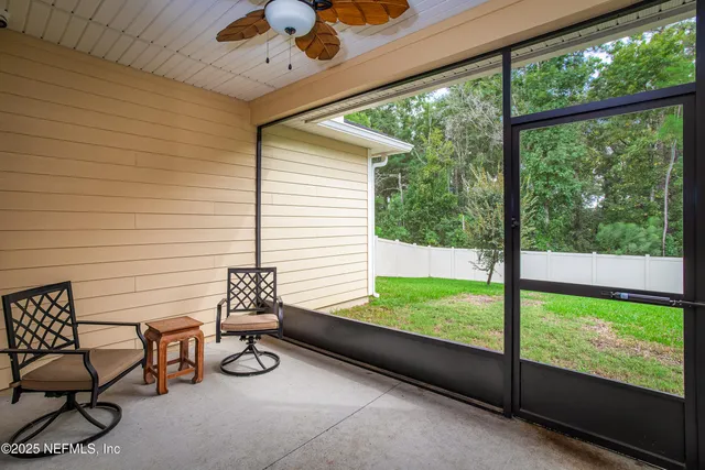 a view of a two chairs in the porch