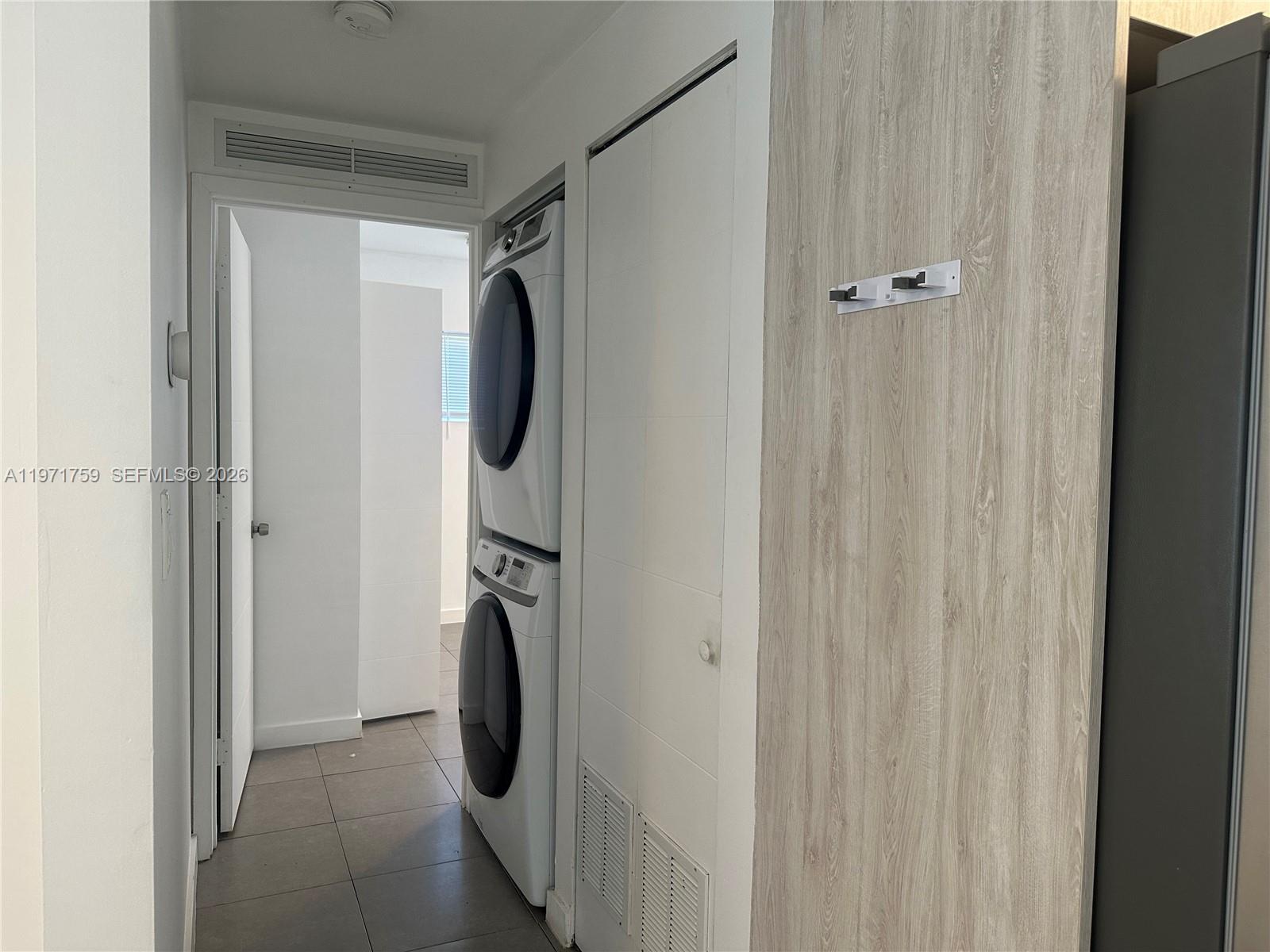 2206 Simms Street Hollywood, FL 33020 - Photo 15 of 23 a view of walk in closet with clothes and shoes