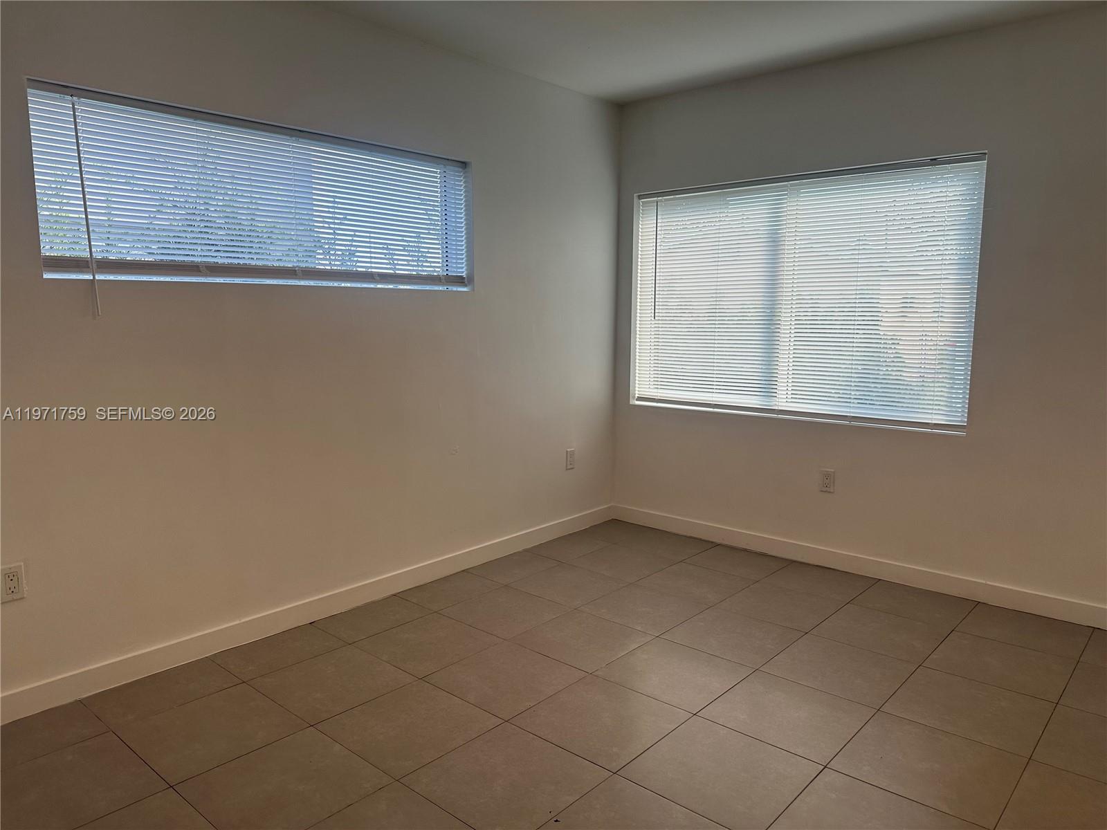 2206 Simms Street Hollywood, FL 33020 - Photo 16 of 23 an empty room with a window