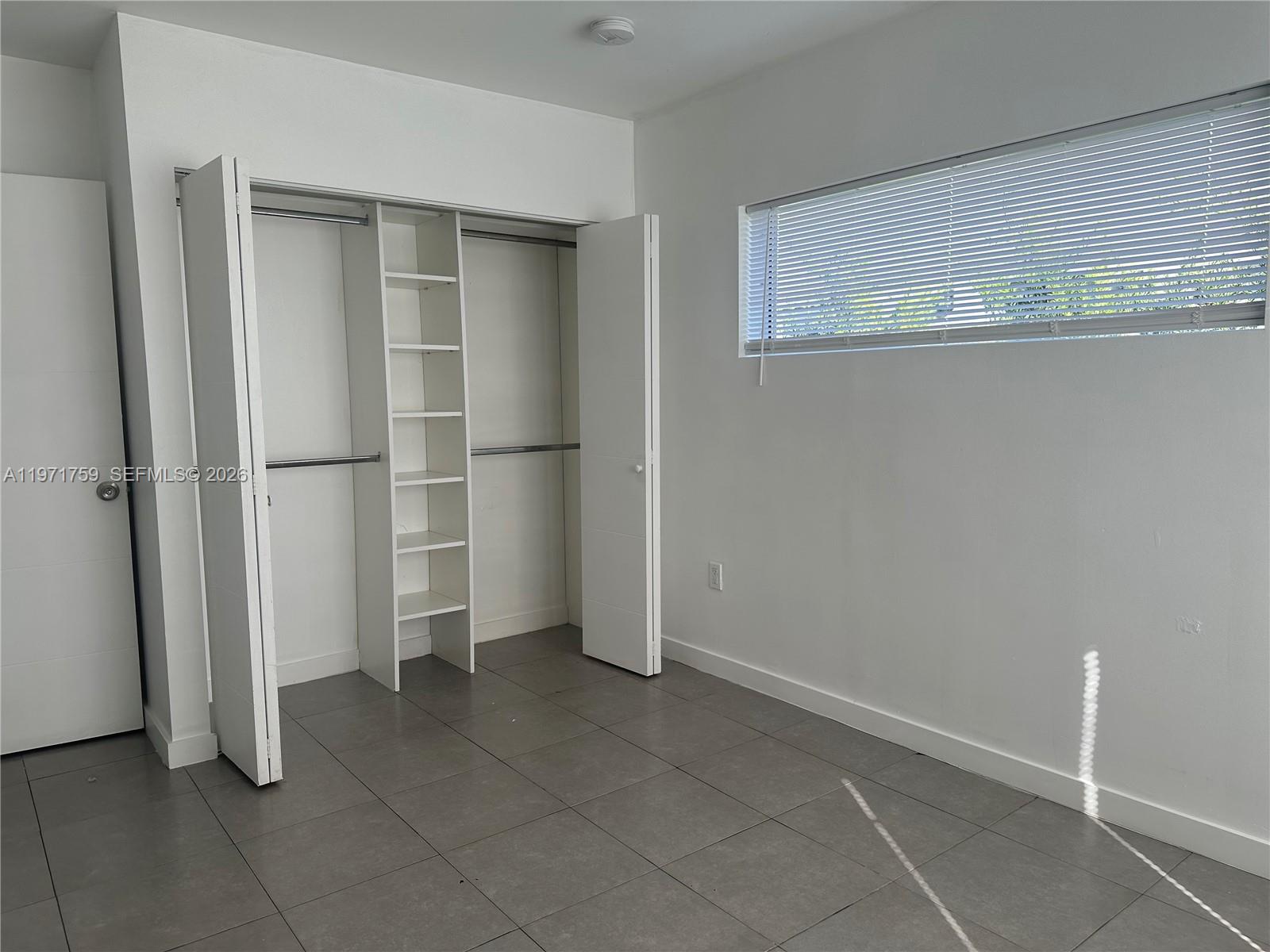 2206 Simms Street Hollywood, FL 33020 - Photo 20 of 23 a view of an empty room with a kitchen