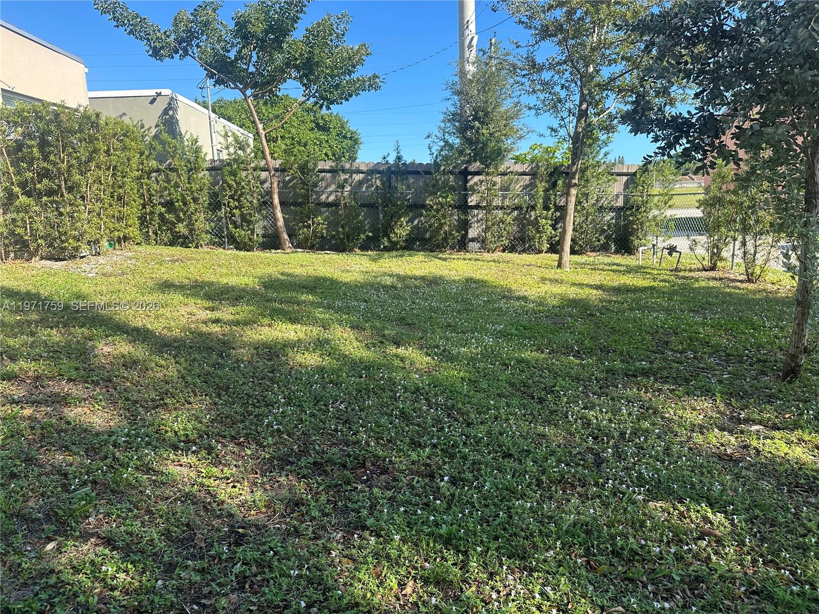 2206 Simms Street Hollywood, FL 33020 - Photo 23 of 23 a view of garden with trees