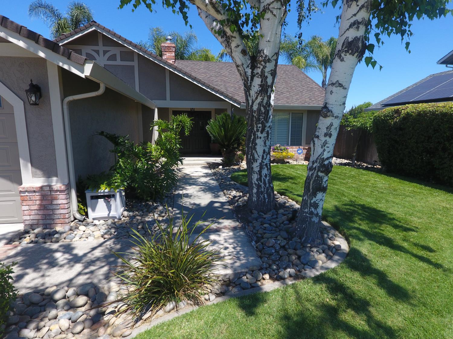 777 Jordanolo Drive Ripon, CA 95366 - Photo 6 of 61 a view of a house with a backyard