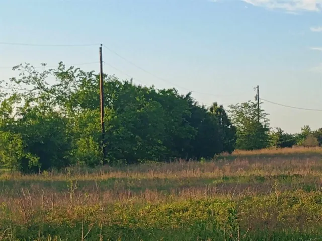 a view of a lake with a big yard