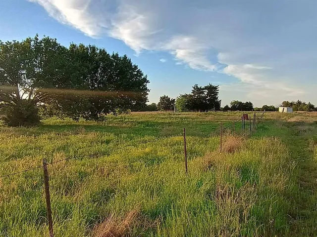 a view of a lake with a big yard