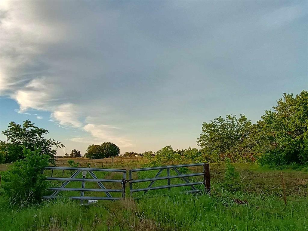 5330 Interstate 30 Campbell, TX 75422 - Photo 33 of 34 a view of green field with wooden fence