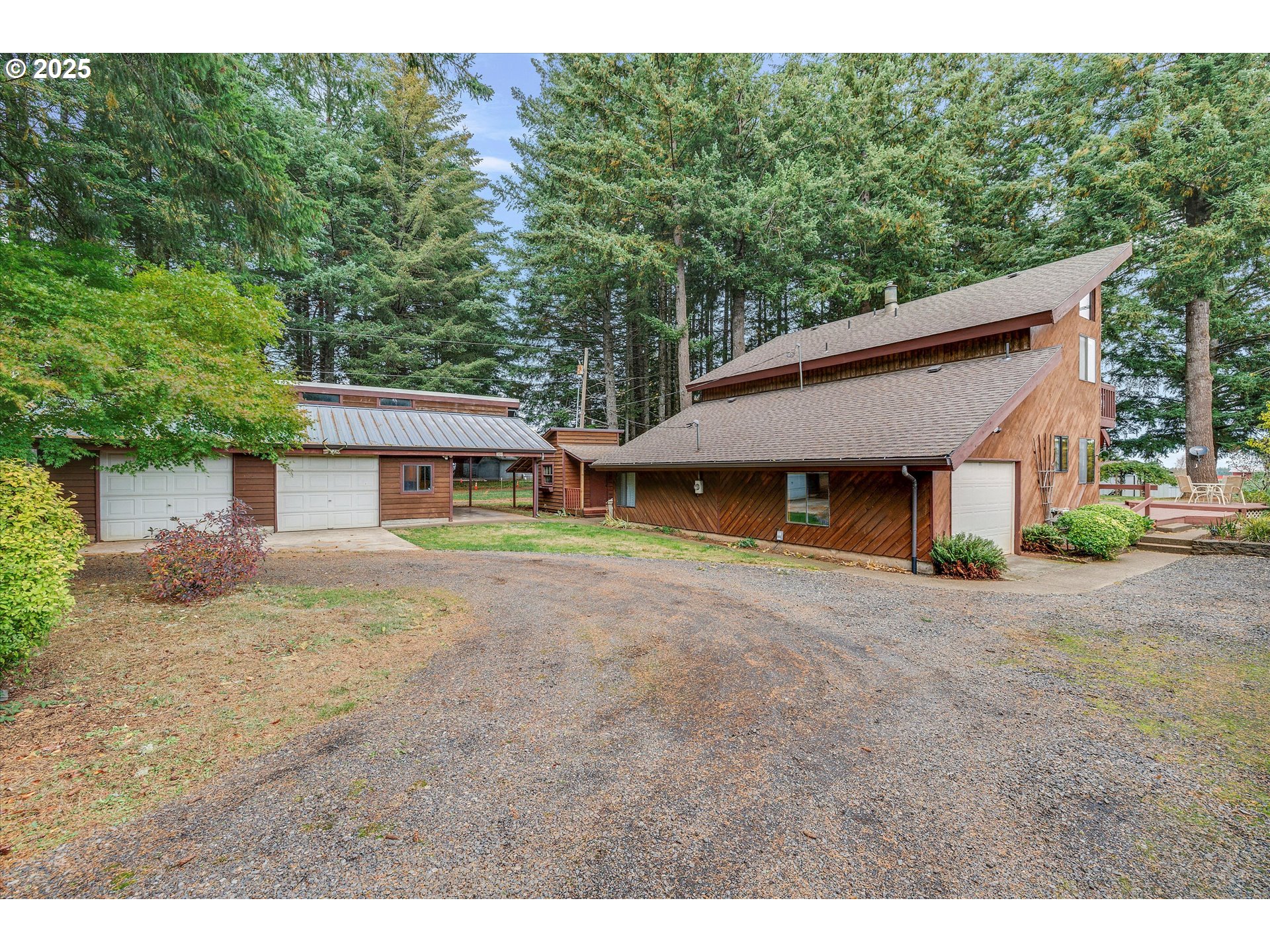 25164 South Springwater Road Estacada, OR 97023 - Photo 19 of 43 a aerial view of a house with a yard and garage