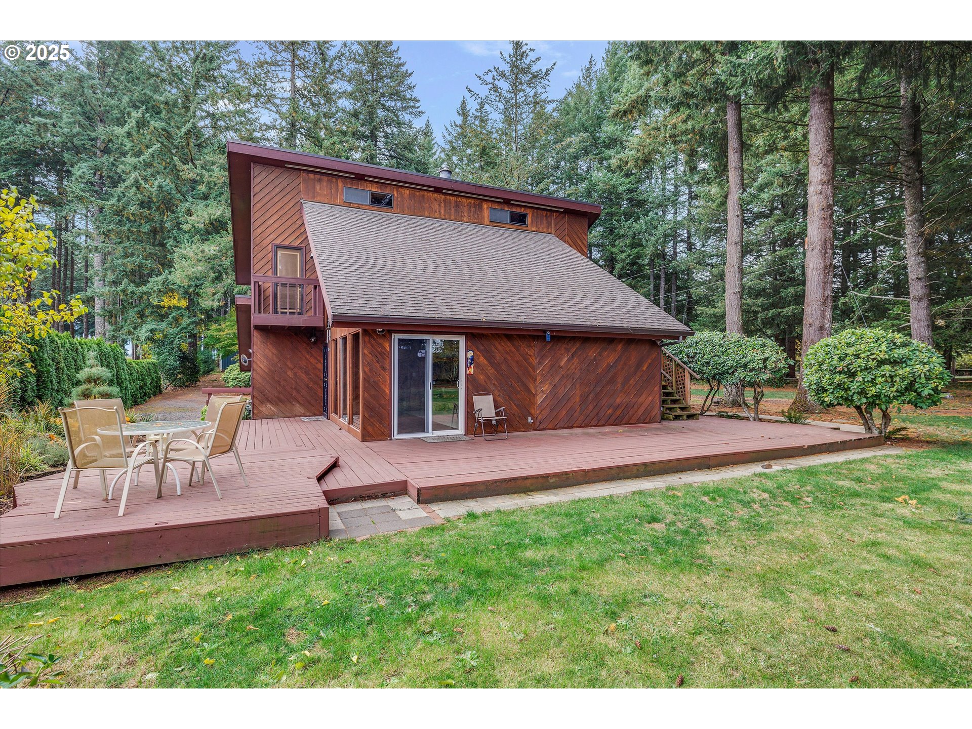 25164 South Springwater Road Estacada, OR 97023 - Photo 29 of 43 a aerial view of a house with a yard table and chairs