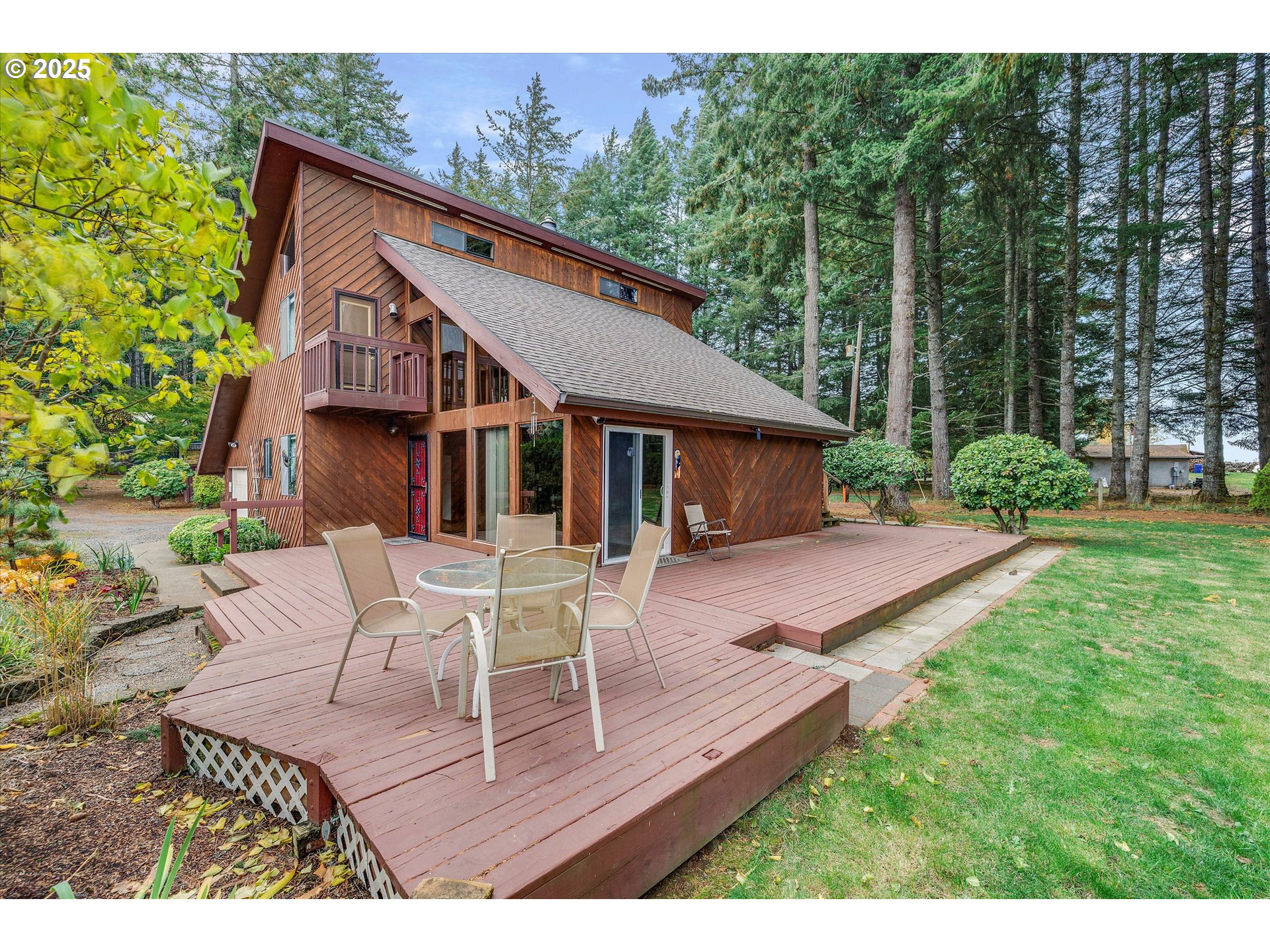 25164 South Springwater Road Estacada, OR 97023 - Photo 30 of 43 a view of house with table and chairs in patio