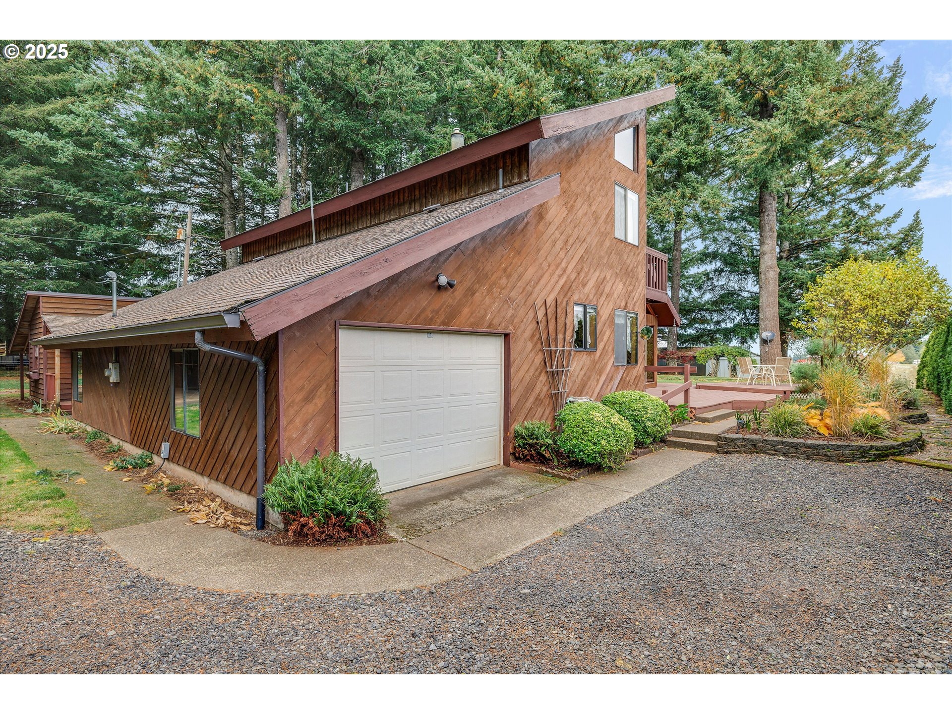 25164 South Springwater Road Estacada, OR 97023 - Photo 32 of 43 a view of a house with a yard and garage