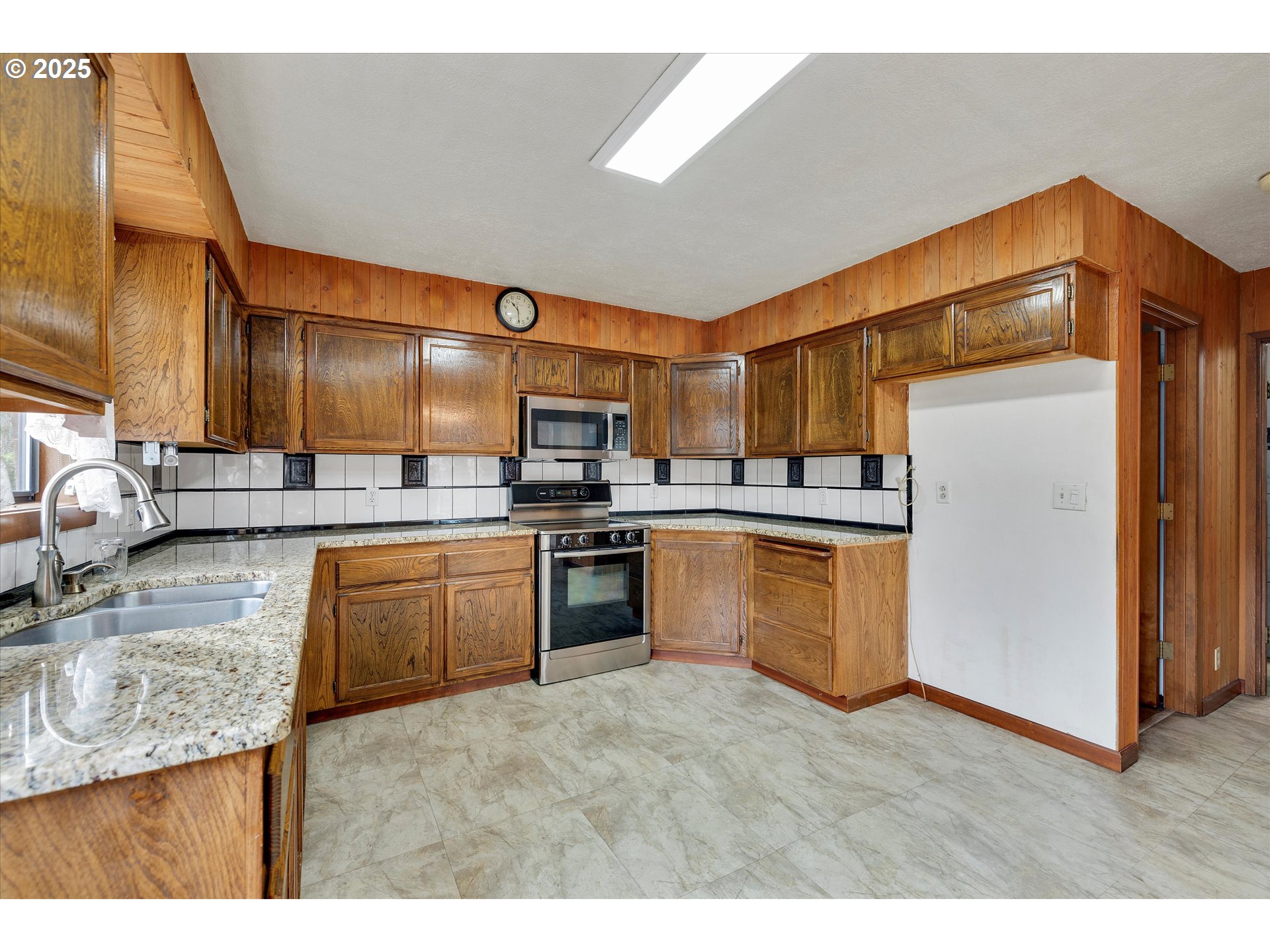 25164 South Springwater Road Estacada, OR 97023 - Photo 5 of 43 a kitchen with a sink cabinets and stainless steel appliances
