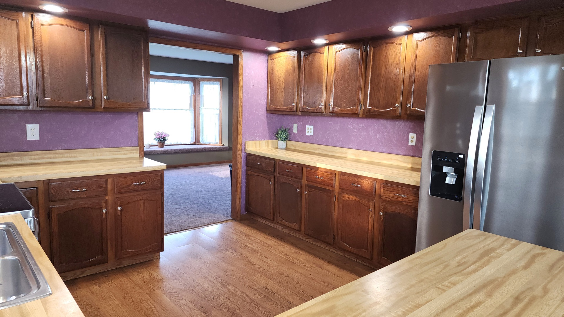 6079 Manchester Road Poplar Grove, IL 61065 - Photo 46 of 69 a kitchen with stainless steel appliances granite countertop a refrigerator a sink dishwasher and wooden cabinets