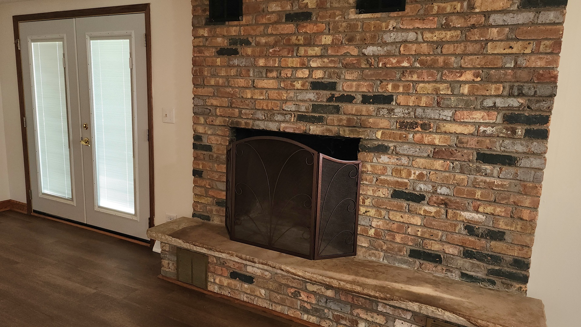 6079 Manchester Road Poplar Grove, IL 61065 - Photo 48 of 69 a room with a wooden floor and a fireplace
