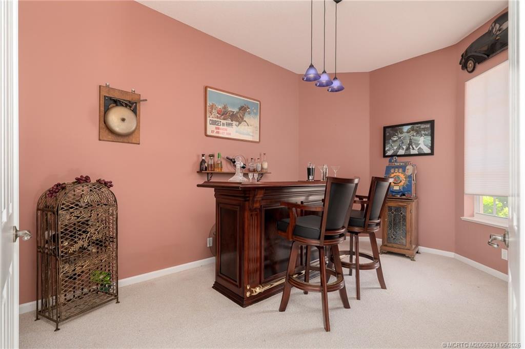 2216 Southeast Stonehaven Road Port St. Lucie, FL 34952 - Photo 11 of 67 a dining room with furniture and window