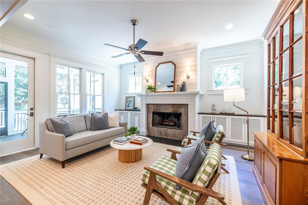 538 Ansley Street Decatur, GA 30030 - Photo 18 of 73 a living room with furniture a fireplace and a floor to ceiling window