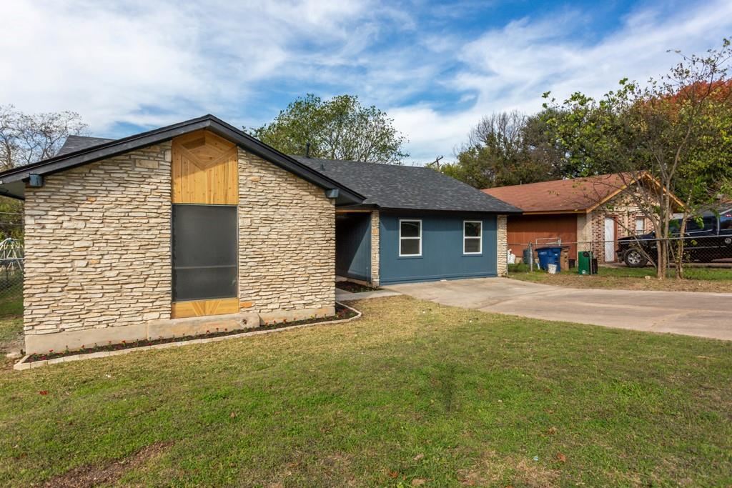 A striking facade with varied textures and a practical driveway, offering easy access.