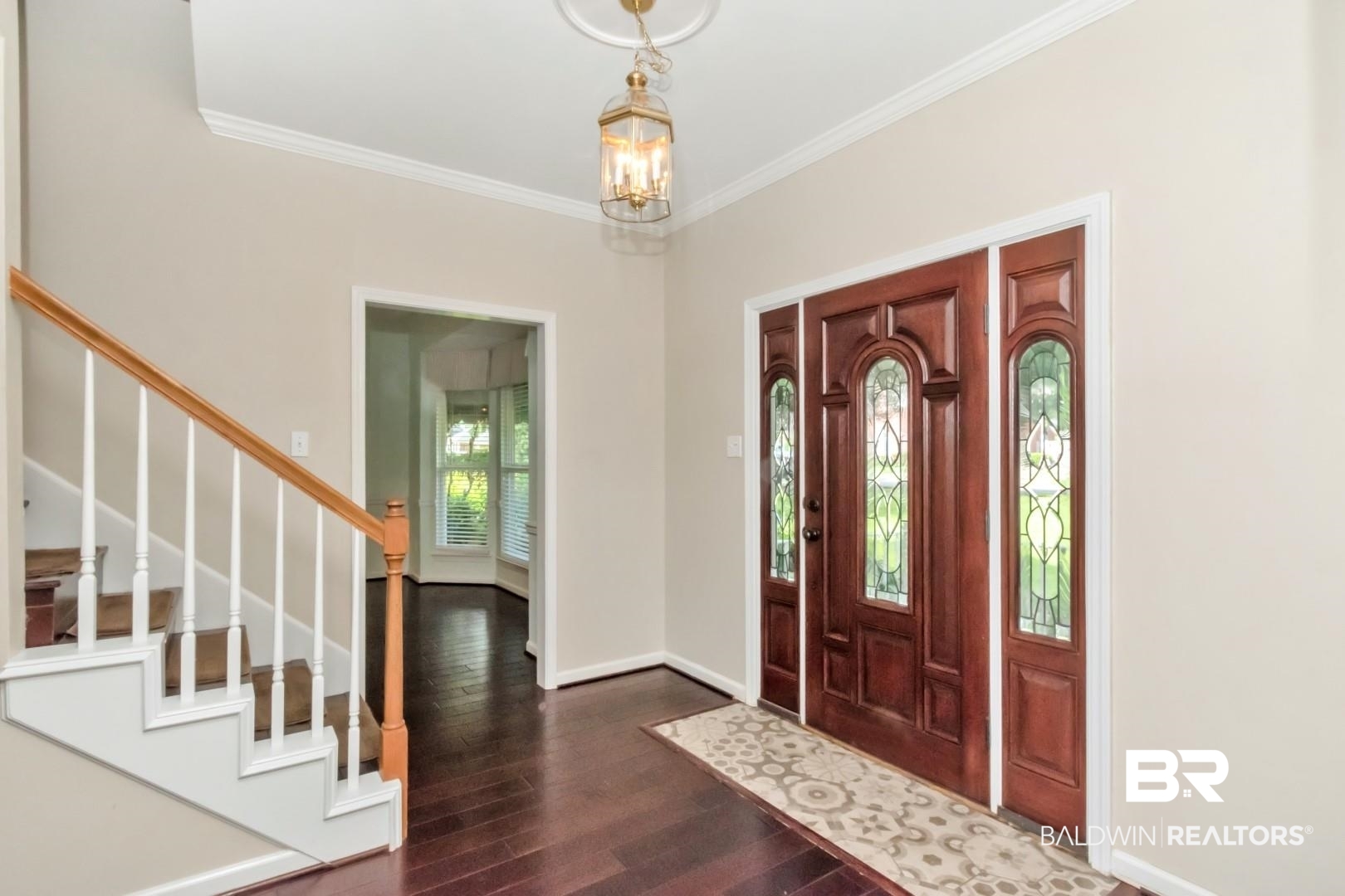 1071 Southern Way Court Mobile, AL 36609 - Photo 2 of 44 Entryway with an inviting chandelier, dark hardwood / wood-style floors, and ornamental molding