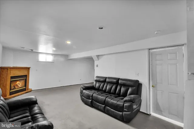 a walk in closet with a couch