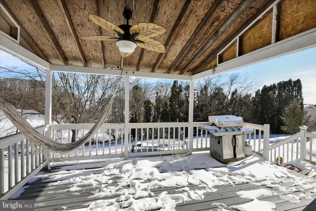 a view of a chair and tables in the balcony