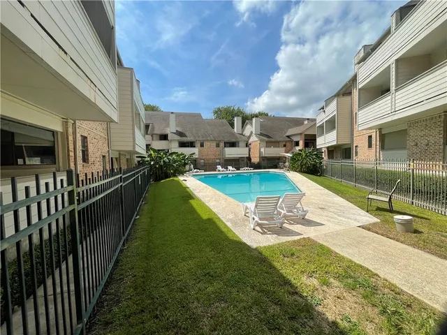 a view of a swimming pool with a garden