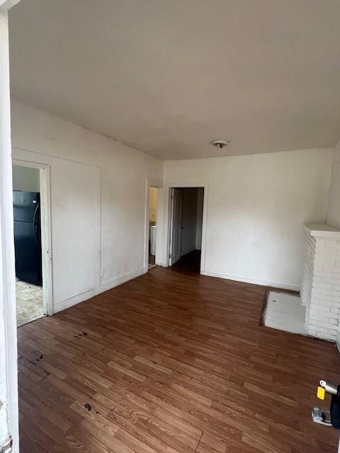 400 East Cotton Street Longview, TX 75601 - Photo 3 of 10 a view of an empty room with wooden floor and a window