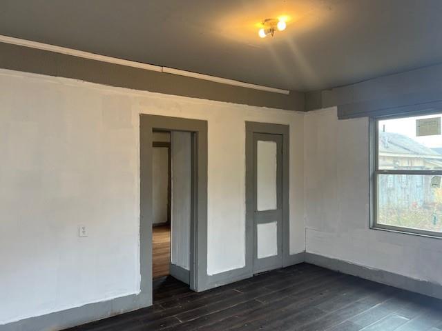 400 East Cotton Street Longview, TX 75601 - Photo 10 of 10 a view of an empty room with wooden floor and a window