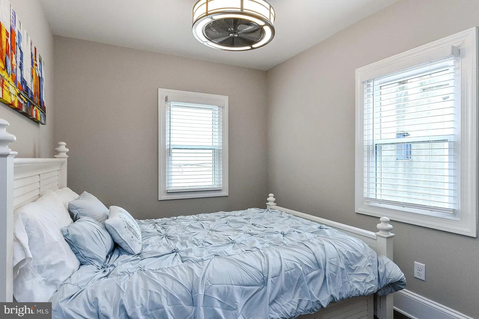 734 Light Street, Unit 2 Baltimore, MD 21230 - Photo 12 of 17 a bedroom with a bed and a window