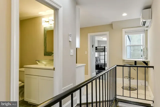 a bathroom with a sink and a window