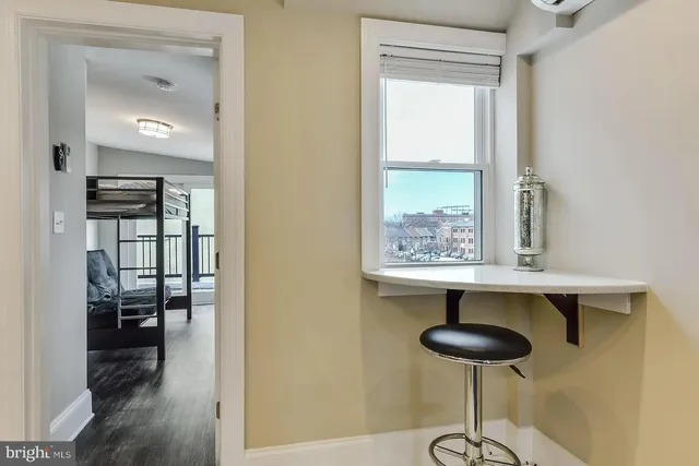 a room with a table and chairs