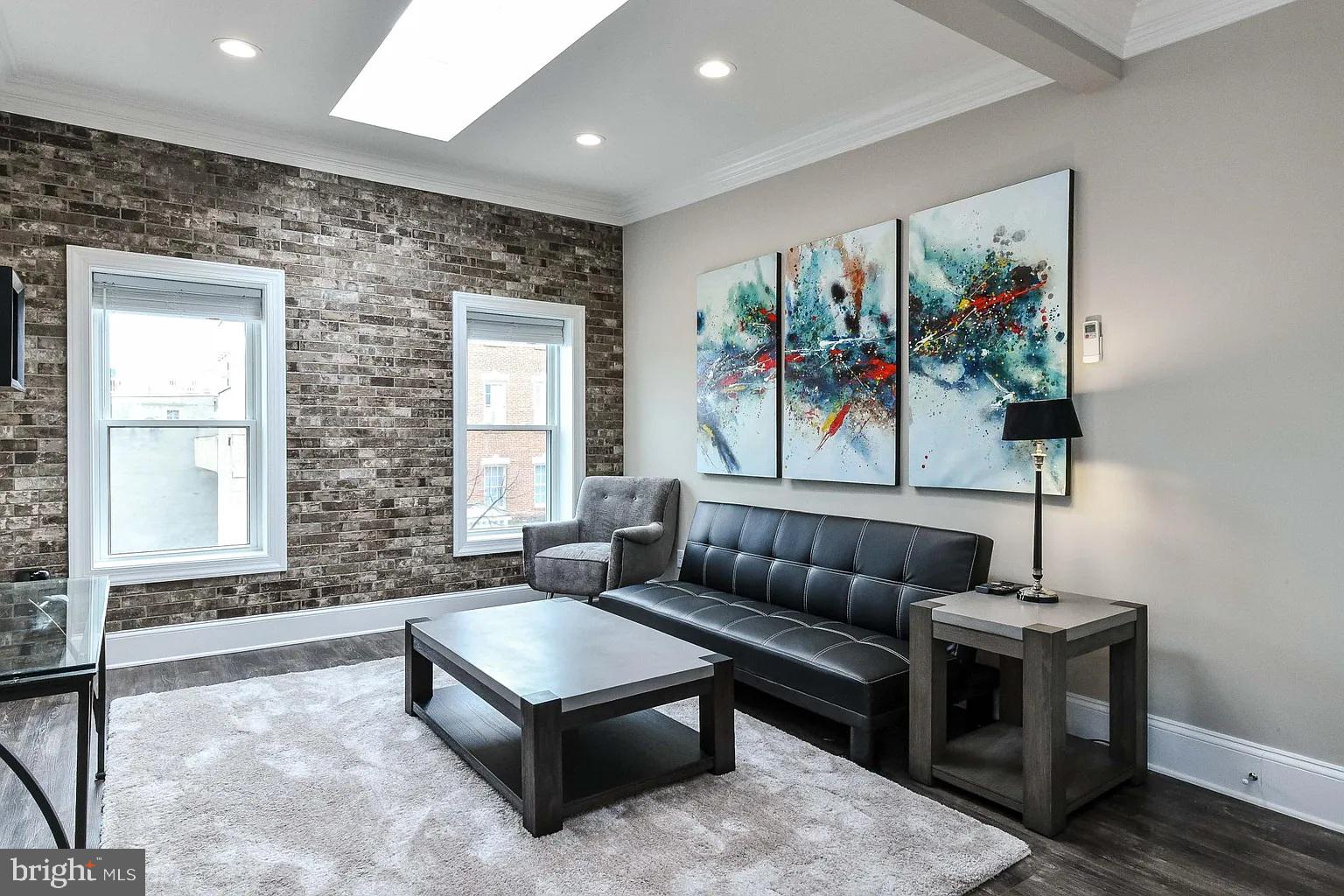 734 Light Street, Unit 2 Baltimore, MD 21230 - Photo 4 of 17 a living room with furniture and a window