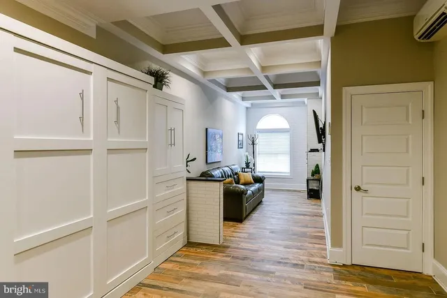 a view of a living room with a wooden floor