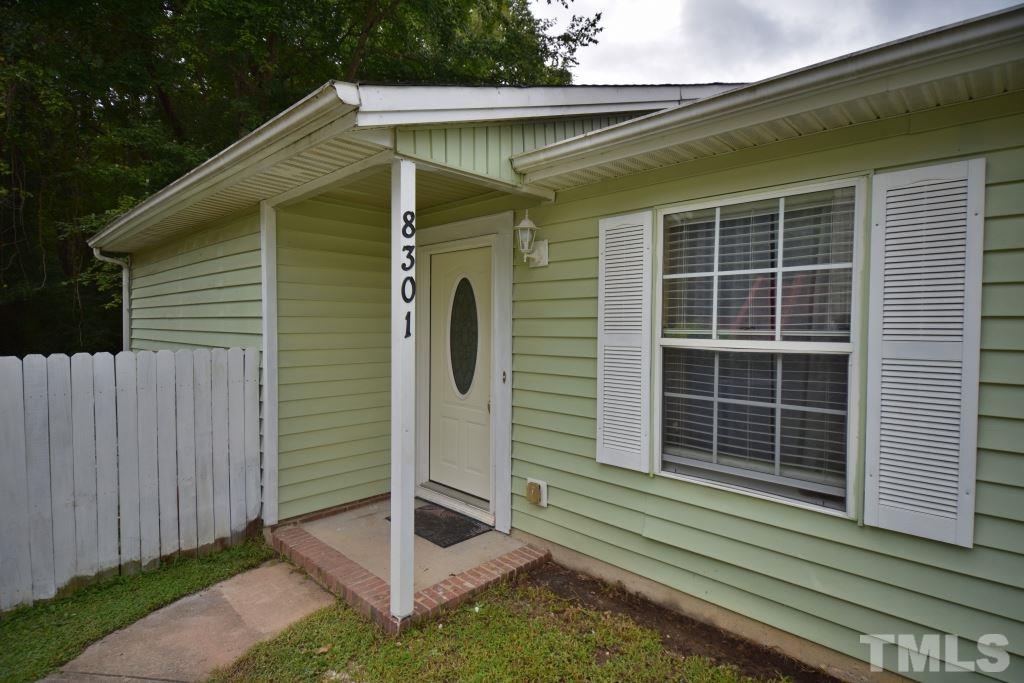 8301 Wynewood Court Raleigh, NC 27616 - Photo 2 of 22 a view of small house with backyard