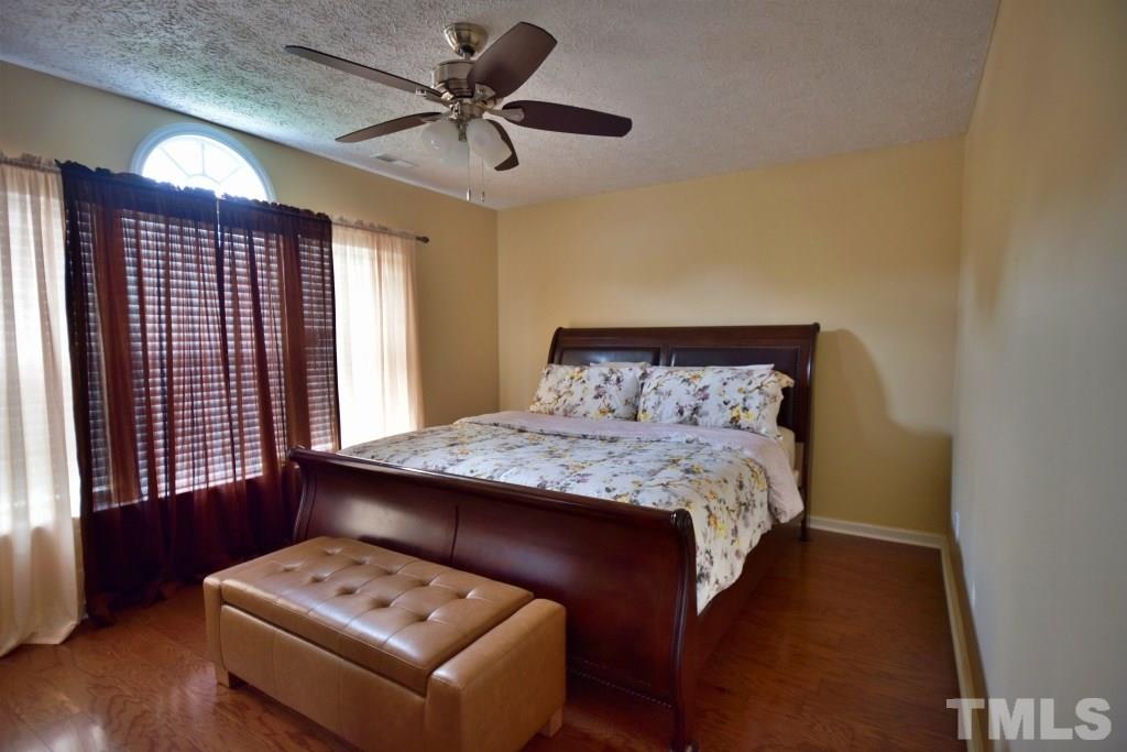 8301 Wynewood Court Raleigh, NC 27616 - Photo 19 of 22 a bedroom with a bed and a window