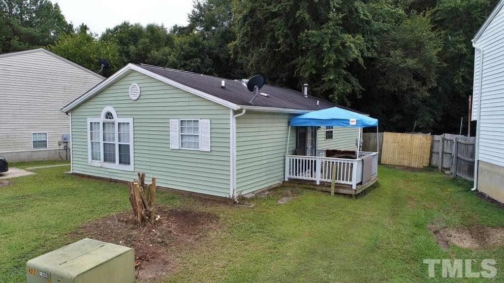 8301 Wynewood Court Raleigh, NC 27616 - Photo 3 of 22 a view of a house with a yard