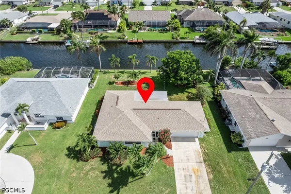 an aerial view of a house with outdoor space