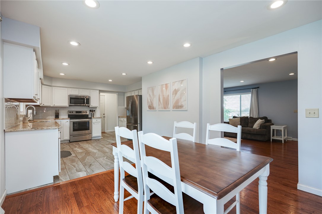 6950 Red Lion 5 Points Road Springboro, OH 45066 - Photo 17 of 78 This open concept kitchen and dining area features sleek appliances and ample space for gatherings.