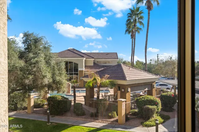 a view of a house with a backyard