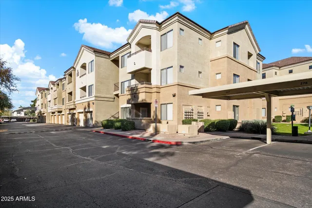 a view of a house with yard and sitting area